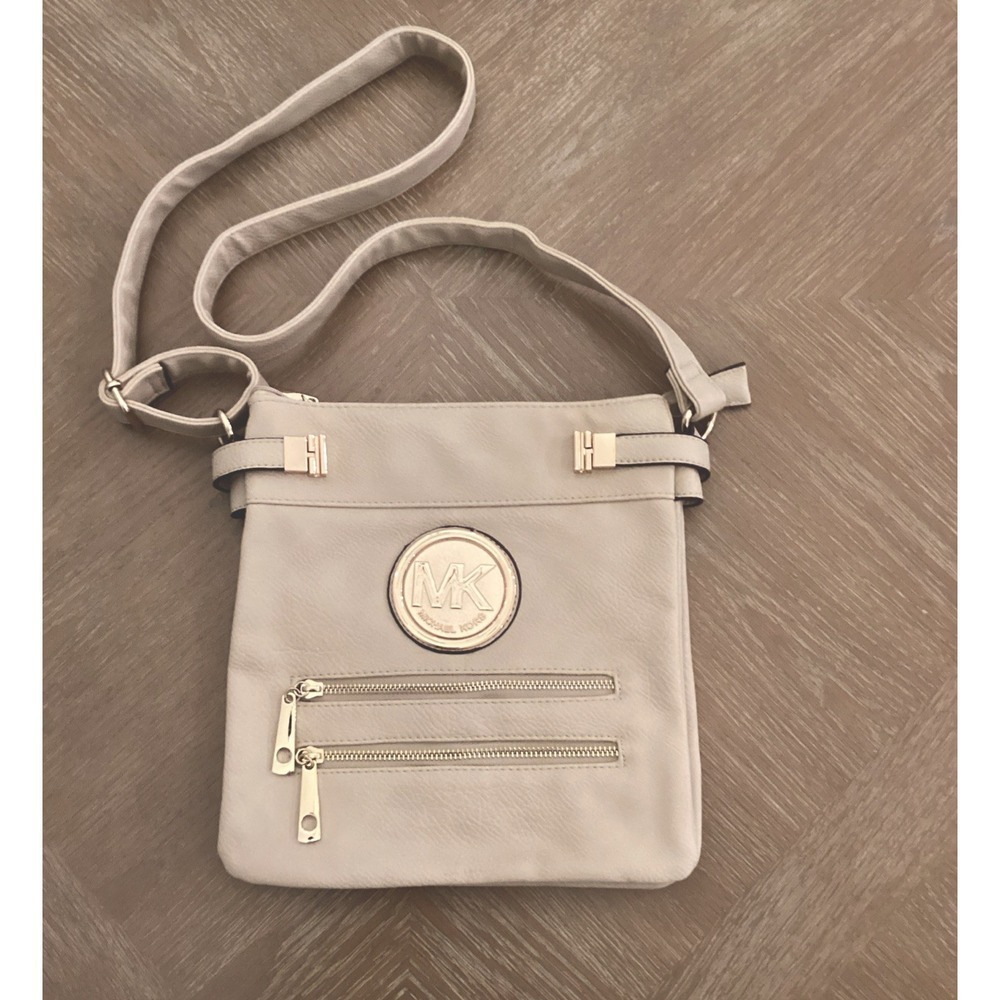 Michael Kors Beige Leather Shoulder Bag With Gold Accents And Multiple Pockets